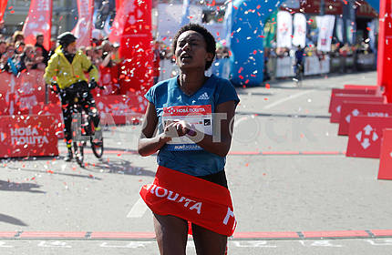 Dark-skinned runner in the distance