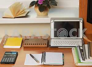 Stack of hardback books on wooden table. Back to school. Copy space. Top view