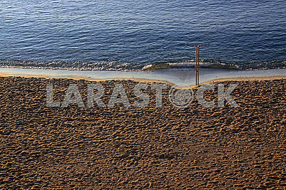 People trampled sand on the Mediterranean Sea beach