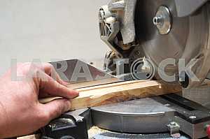 Carpenter tools on wooden table with sawdust. Circular Saw.