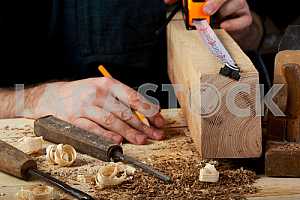 Carpenter tools on wooden table with sawdust. Circular Saw.