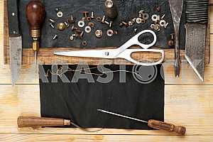 Carpenter tools on wooden table with sawdust. Circular Saw.