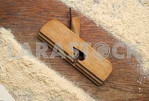 Different construction tools on a wooden background - screwdriver, caliper.