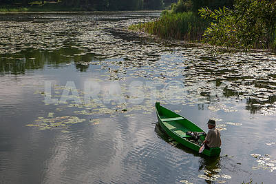 A man in a boat on the lake