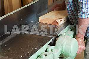 Carpenter tools on wooden table with sawdust. Circular Saw. Carpenter workplace top view