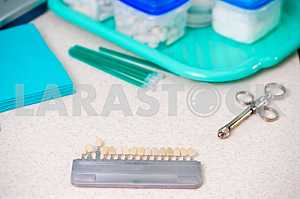 Stomatological instrument in the dentists clinic. Operation, tooth replacement.