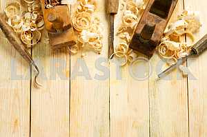 Carpenter tools on wooden table with sawdust. Circular Saw.