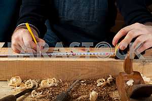 Carpenter tools on wooden table with sawdust. Circular Saw.