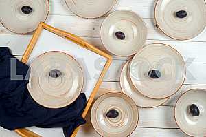 Blank white dish on a wood background.
