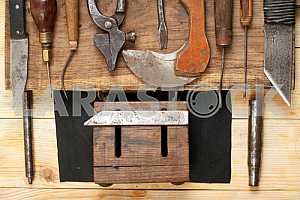 Carpenter tools on wooden table with sawdust. Circular Saw.