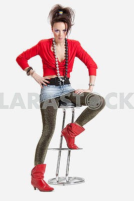 Picture of a young playful lady on a high chair