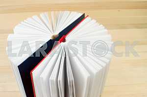 Stack of hardback books on wooden table. Back to school. Copy space