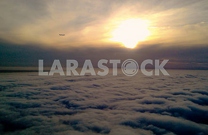 Airplane against the background of sunrise