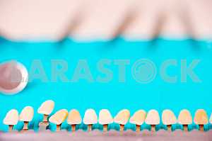 Stomatological instrument in the dentists clinic. Operation, tooth replacement.