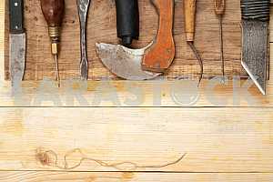 Carpenter tools on wooden table with sawdust. Circular Saw.