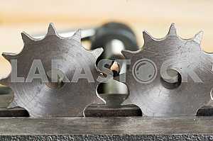 Different construction tools on a wooden background - screwdriver, caliper.