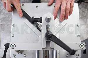 Carpenter tools on wooden table with sawdust. Circular Saw.