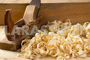 Carpenter tools on wooden table with sawdust. Circular Saw.