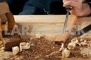 Carpenter tools on wooden table with sawdust. Circular Saw.