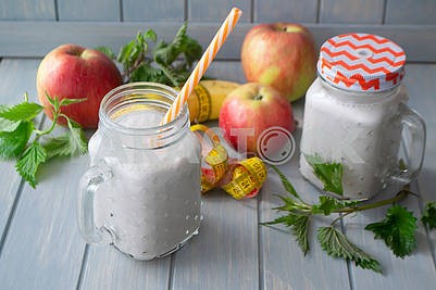 Healthy organic smoothie with apples, bananas and nettle