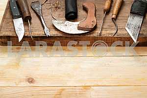 Carpenter tools on wooden table with sawdust. Circular Saw.