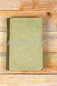 Open book, stack of hardback books on wooden table. Back to school. Copy space