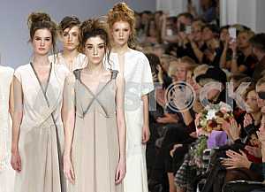Spectators look at the models that demonstrate outfits Ukrainian designer Tatyana and Alyona Zemskova Vorozhbit