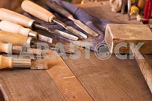 Carpenter tools on wooden table with sawdust. Circular Saw. Carpenter workplace top view