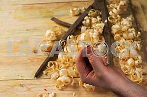 Carpenter tools on wooden table with sawdust. Circular Saw.