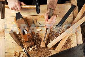 Carpenter tools on wooden table with sawdust. Circular Saw.