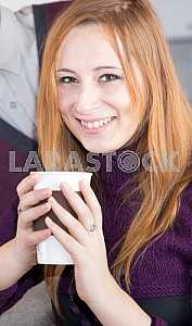Young happy couple drinking tea in the morning