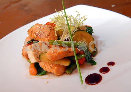 Salad of grilled vegetables with slices of salmon