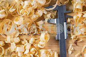 Carpenter tools on wooden table with sawdust. Circular Saw.