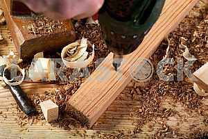 Carpenter tools on wooden table with sawdust. Circular Saw.