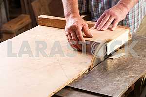 Carpenter tools on wooden table with sawdust. Circular Saw. Carpenter workplace top view