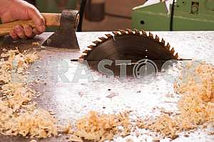 Carpenter tools on wooden table with sawdust. Circular Saw. Carpenter workplace top view