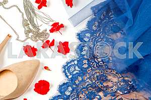 Woman clothes and accessories. Soft blue colors female apparel.