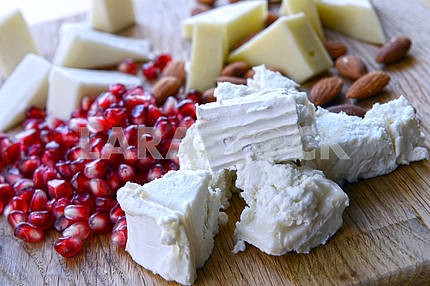 Set of goat cheese on a wooden board