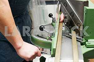 Different construction tools on a wooden background - screwdriver, caliper.