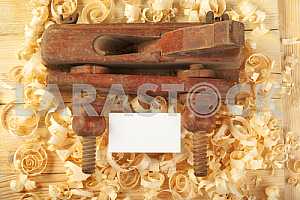Carpenter tools on wooden table with sawdust. Circular Saw.