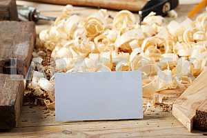 Carpenter tools on wooden table with sawdust. Circular Saw.