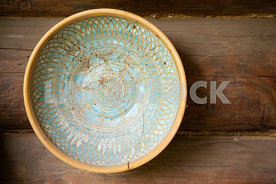 Typical ethnic porcelain bowl with floral and ornamentic pattern. Traditional styled souvenir from Belarus.