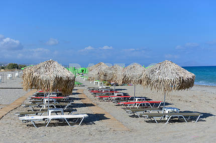 thatched umbrellas on the beach