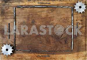 Different construction tools on a wooden background - screwdriver, caliper.