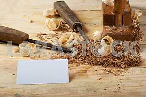 Carpenter tools on wooden table with sawdust. Circular Saw.