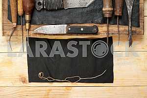 Carpenter tools on wooden table with sawdust. Circular Saw.