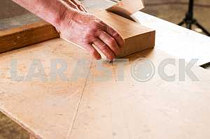 Carpenter tools on wooden table with sawdust. Circular Saw. Carpenter workplace top view