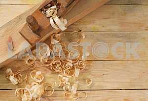 Carpenter tools on wooden table with sawdust. Circular Saw.