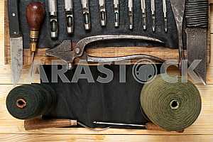 Carpenter tools on wooden table with sawdust. Circular Saw.