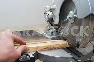 Carpenter tools on wooden table with sawdust. Circular Saw.
